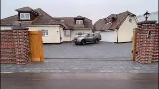 Large sliding electric gate made from hardwood fully installed with gsm  intercom.