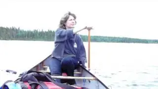 In a canoe, Crystal demonstrates the 