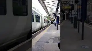 Class 717 leaves drayton park train station on 3rd rail power supply