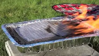 Wegwerp barbecue aansteken