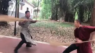 Uncle use besom as weapon to flight. Chinese KungFu can use anything as weapon
