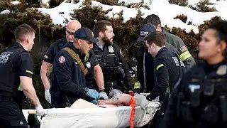Angry protesters throw snowballs after US immigration officer kills driver in Minneapolis