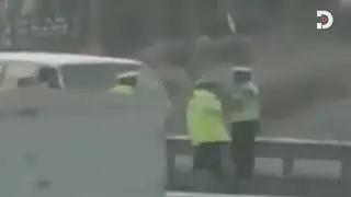 Traffic police officers caught on camera fighting beside the road