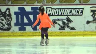 4 year old ice skater jumping on ice