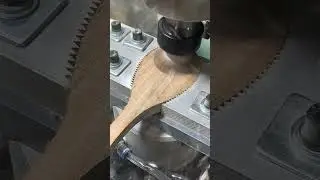Cutting the bowl of a wooden spoon