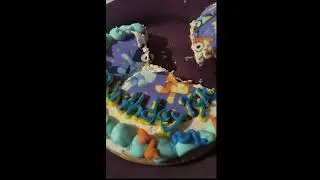 trying the bluey cookie that my work made for me for my bithday