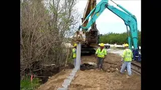 Vibratory Plate Compactor ShoreGuard&reg; Vinyl Sheet Piling Installation
