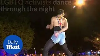 Gay rights activists dance in protest against VP-elect Pence - Daily Mail