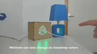 Wattom: A Consumption and Grid Aware Smart Plug with Mid-Air Controls