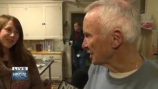 Volunteers work to serve breakfast at local shelter