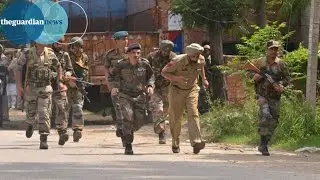 Indian security forces fire shots after militants seize police station