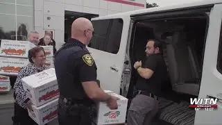 Greenville police continue Thanksgiving meal boxing partnership with car dealership