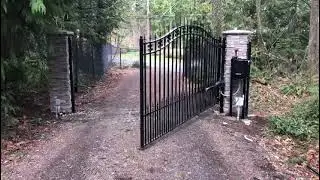 Wrought Iron Gate with Stone Pillars  AD Construction Property Entrance Automation