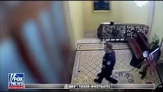 Qanon Shaman Jake Angeli led by police on tour guide through Capitol on January 6th
