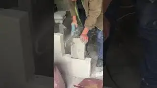 Cutting bricks with a chainsaw for fast construction work