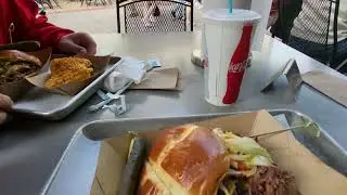Eating at Polite Pig at Disney Springs - BBQ Sandwich and corn