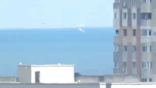 Zoom on a ship on the other side of the horizon