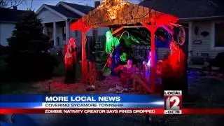 Zombie nativity creator says fines dropped