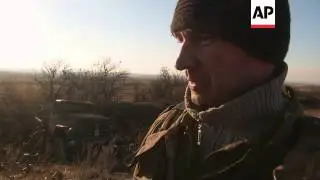 Troop movement and rebel fighter on ceasefire