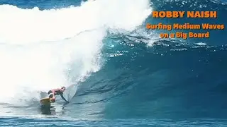 Surfing medium sized waves on a big board