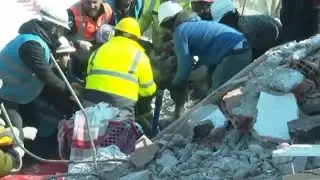 Woman pulled from quake rubble in Turkey