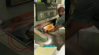 Guillotine paper cutter operator mishandle.