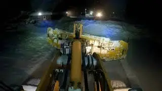 CASE 721E with metal pless plowing snow