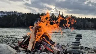 Bonfire. River. Mountains