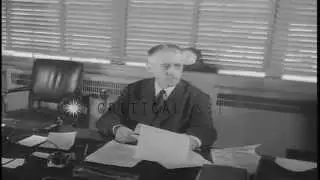 US Secretary of War Henry Lewis Stimson seated at a desk in his office in Washing...HD Stock Footage