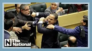 Watch Jordanian members of parliament scuffle during debate
