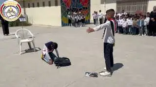 مراسيم رفع العلم العراقي وتسليم الراية من تلاميذ الصف السادس الى تلاميذ الصف الخامس