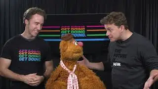 Marc Kielburger and Craig Kielburger with Fozzie Bear