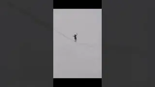 (Jan Roose) Walking on a tight rope across bridge & train tracks in Lagos. #RedBullChallenge