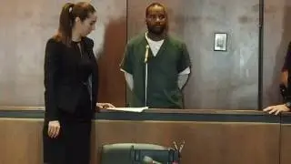 Robbery suspect arraigned on charge of murdering witness