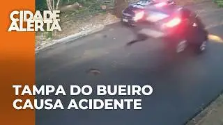 Veículo atinge árvore após tampa de um bueiro soltar durante passagem, no PR
