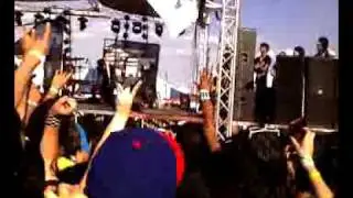 ALESANA BASSIST KIKCKIN DOWN A SIGN