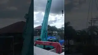Transfering of pumpcrete using telescopic crane equipment. 