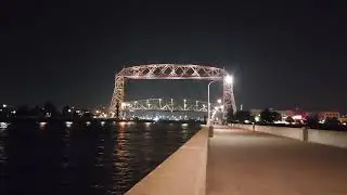 Fishing boat going under Lift Bridge
