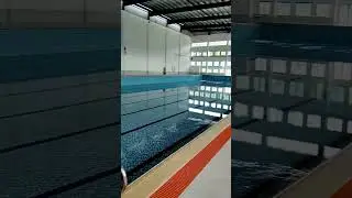 The swimming pool is being filled with water. Equipments for water treatment are to be installed.