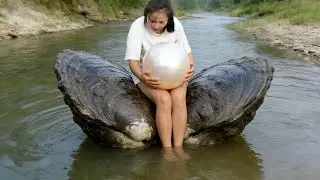 Pry open a huge river clam and harvest a night pearl bigger than a basketball