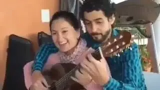 The Most loving and talented couple playing one Guitar at the same time