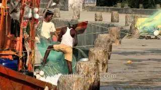 Fishermen prepare a fishing net at Frazerganj, West Bengal