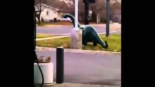 Dog attacking Sinclair dinosaur
