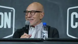 French fan offers a bottle of the real Chateau Picard to Sir Patrick Stewart