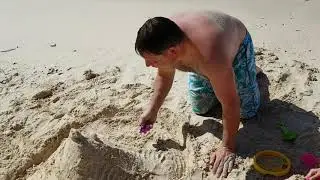Sand castle making with daddy