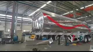 Video display of tank transport trailer factory workshop.