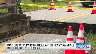 Road crews repair sinkhole after heavy rainfall