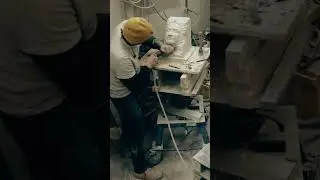 Carving a life sized head using a pointing machine