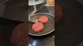 Mushroom Swiss burger with saut&eacute;ed spinach