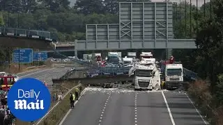 M20 closed after lorry crash causes footbridge collapse - GVs - Daily Mail